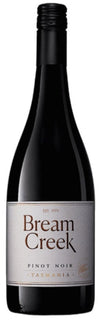 Bream Creek Pinot Noir wine bottle on a white background