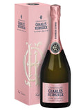 A bottle of Charles Heidsieck Champagne Rose Reserve next to its pink presentation box, featuring a pink foil top and a pink label on a white background.