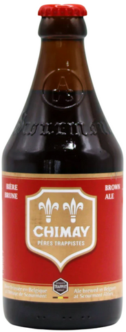 Chimay beer bottle with red label on a white background