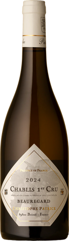 A bottle of Christophe Patrice Chablis 1er Cru 2024 white wine, featuring a dark brown glass bottle, a cream-colored neck label, and a prominent diamond-shaped white label with gold text.