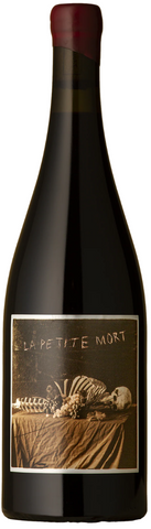Bottle of La Petite Mort Gamay Noir 2025 on white background