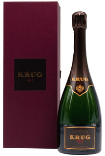 Bottle of Krug champagne with a matching box on a white background
