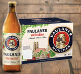 Paulaner beer bottle and six-pack on a wooden plank background