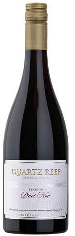 Wine bottle labeled 'Quartz Reef' on a white background
