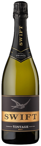 Swift sparkling wine bottle on a green background