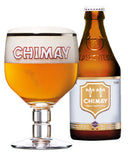 A bottle of Chimay Trèfe Innombrable beer next to a filled tulip glass showing the golden beer and white foam head, on a white background.