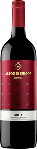 Red wine bottle with a red label featuring 'Altos Ibéricos' branding.